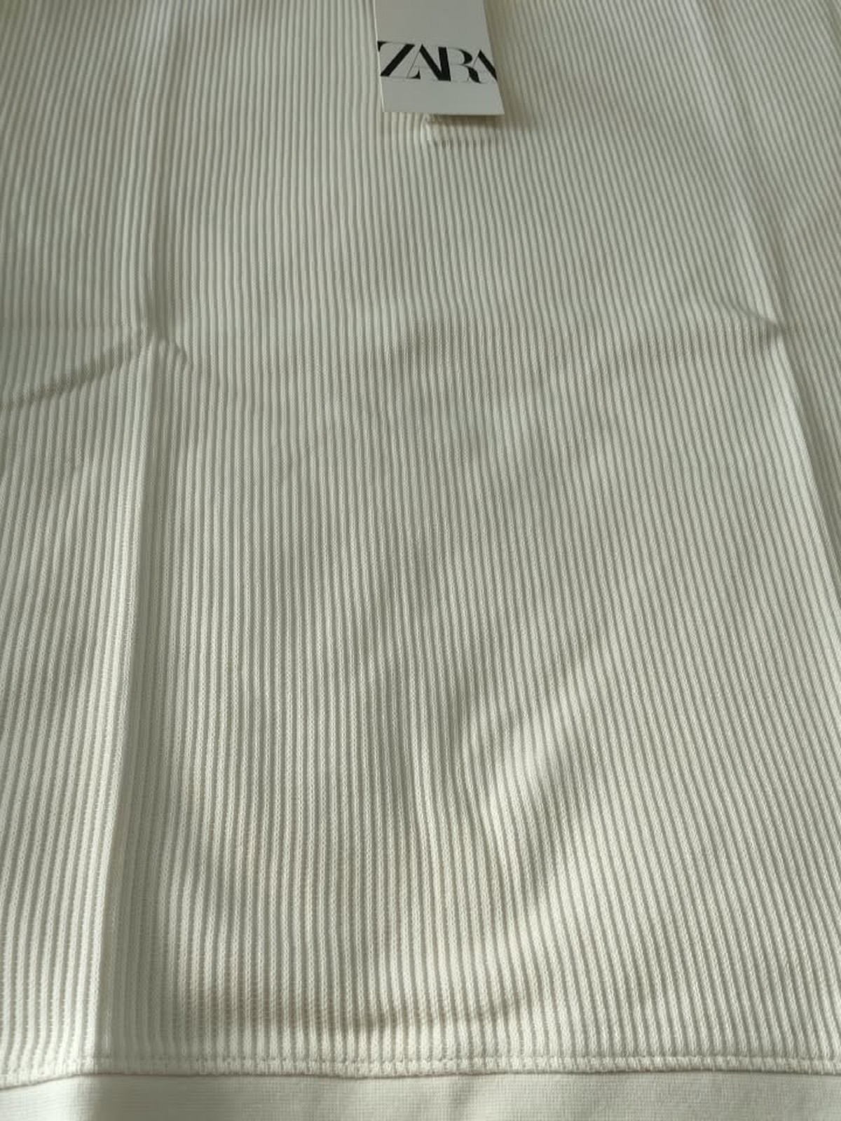 Ribbed Polo — Cream Texture Detail